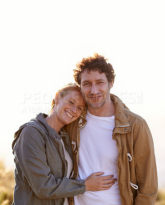 Buy stock photo Happy couple, hug outdoor and portrait in park, love and support with date for bonding and time together. Sunset, nature and people in forest for fresh air, loyalty and commitment with smile