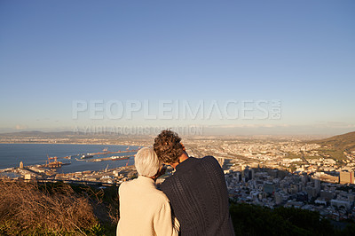 Buy stock photo Senior, couple and city skyline outdoor, happy elderly people on hill for scenic view of buildings and sky. Bonding, care and affection at sunset, hugging and love and relationship or panorama