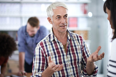 Buy stock photo Businessman, employee and conversation fr teamwork planning in creative studio for art design, project or collaboration. Mature person, woman and talking in London for small business, startup or chat