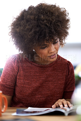 Buy stock photo Black woman, afro and reading with magazine for fashion, style or literature at the office. African female person or creative employee with novel, book or story in journalism or design at workplace