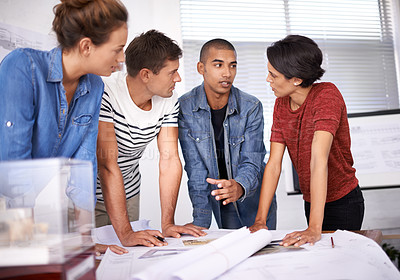 Buy stock photo Shot of a group of young designers working together in an office