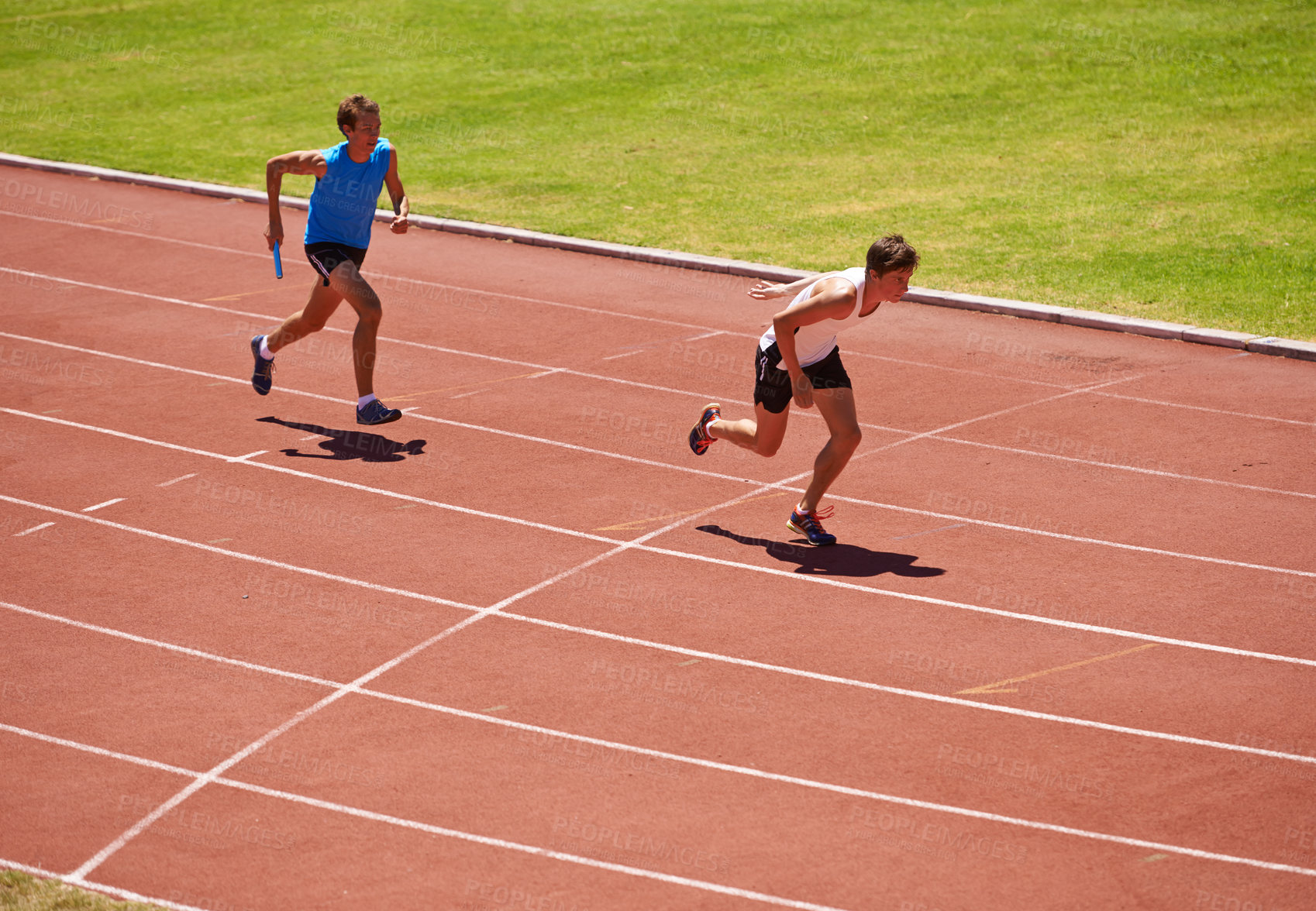 Buy stock photo Athlete, running and race track with relay and teamwork at stadium, fitness and workout outdoor. People in arena, runner and exercise with sports, trust and support for challenge, speed and action