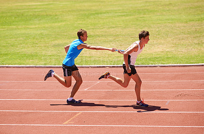 Buy stock photo Athlete, running and race track with relay at stadium, teamwork for fitness and workout outdoor. People in arena, runner and exercise with sports, trust and support for challenge, speed and action