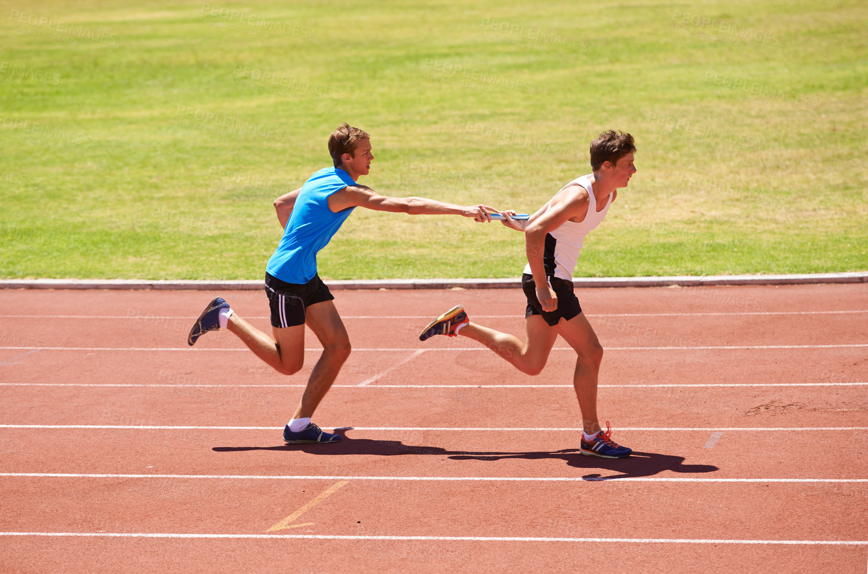 Buy stock photo Athlete, running and race track with relay at stadium, teamwork for fitness and workout outdoor. People in arena, runner and exercise with sports, trust and support for challenge, speed and action