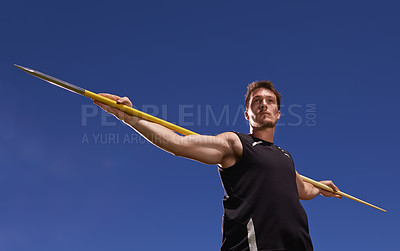 Buy stock photo Man, athlete and javelin or blue sky at sport competition on grass or workout fitness or outdoor, strength or training. Male person, challenge and target strong or exercise performance, aim or skill