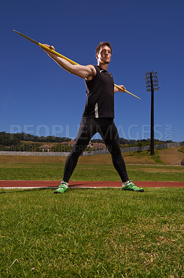 Buy stock photo Man, athlete and javelin or sport exercise for competition on grass for workout fitness or outdoor, strength or training. Male person, challenge and target in arena for performance, aim or practice