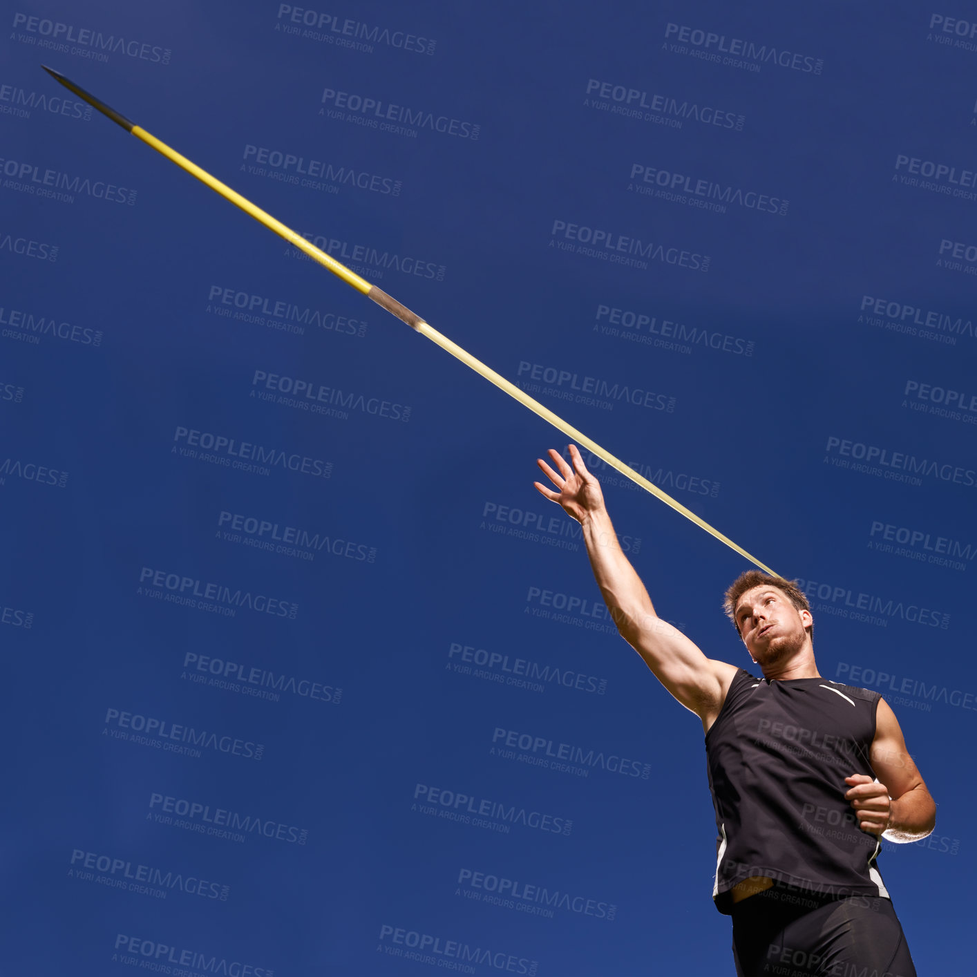 Buy stock photo Shot of a lone man throwing a javelin outside