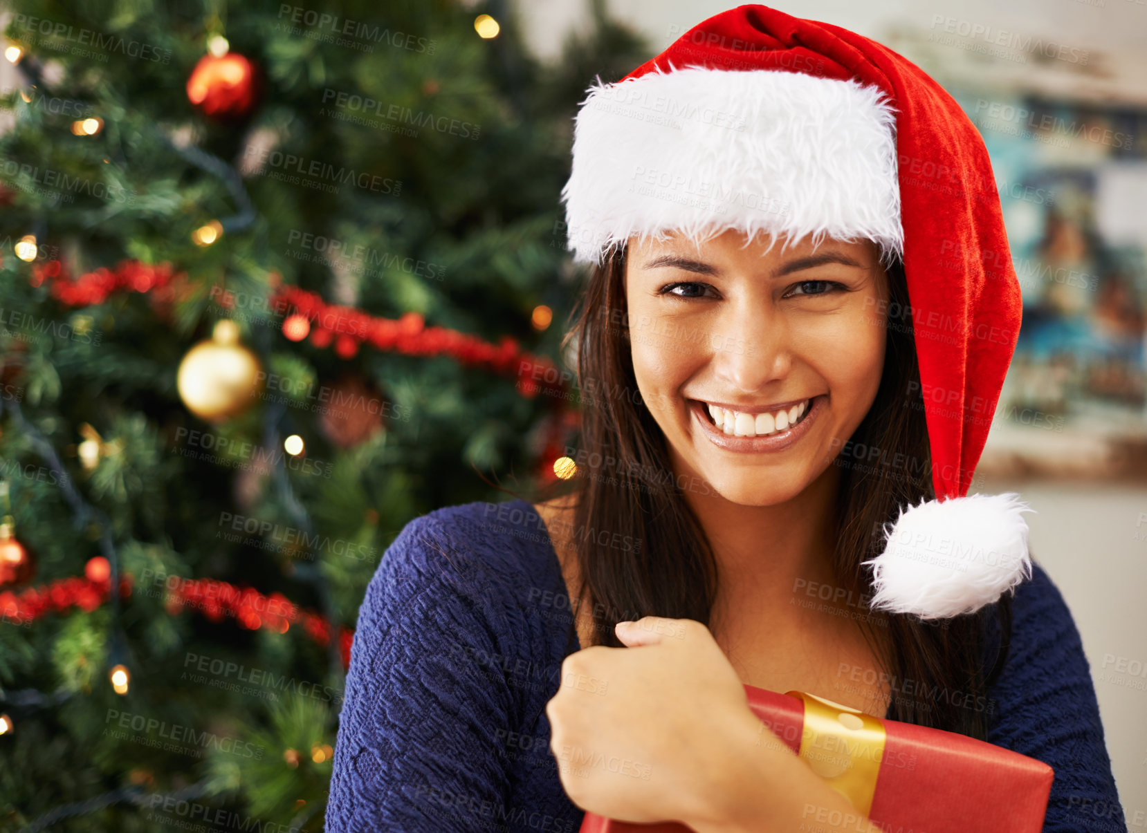 Buy stock photo Christmas, box or portrait of woman with gift in a happy celebration of a Christian holiday in house living room. Smile, face or excited girl holding present with a ribbon to celebrate xmas in Mexico