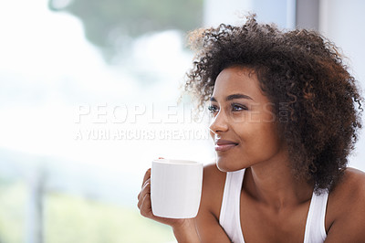 Buy stock photo Cropped shot of a young woman enjoying a cup of coffee