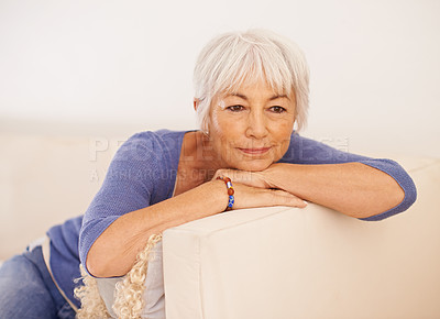 Buy stock photo Mature woman, thinking and smile on couch, peace and memory to remember in living room. Happy female person, positive and planning for wellness in retirement, calm and daydreaming on mockup space