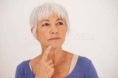 Buy stock photo Thinking, idea and face of elderly woman with closeup, confidence and vision for retirement isolated on white background. Mature lady, female person and contemplating for relax, holiday and pension