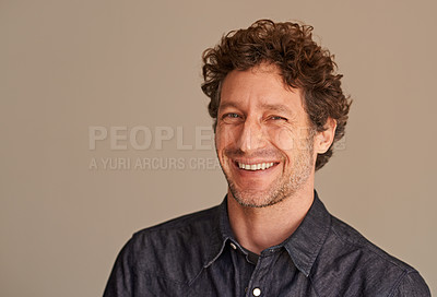 Buy stock photo Mature man, portrait and laugh in studio, comedy and funny memory to remember on brown background. Happy male person, positive and comic for silly or goofy joke, smile and humor on mockup space