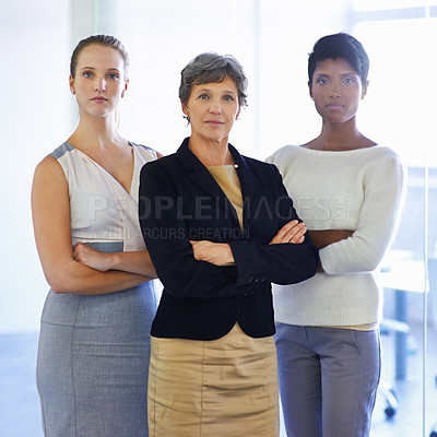 Buy stock photo A portrait of three ambitious businesswoman standing in their office