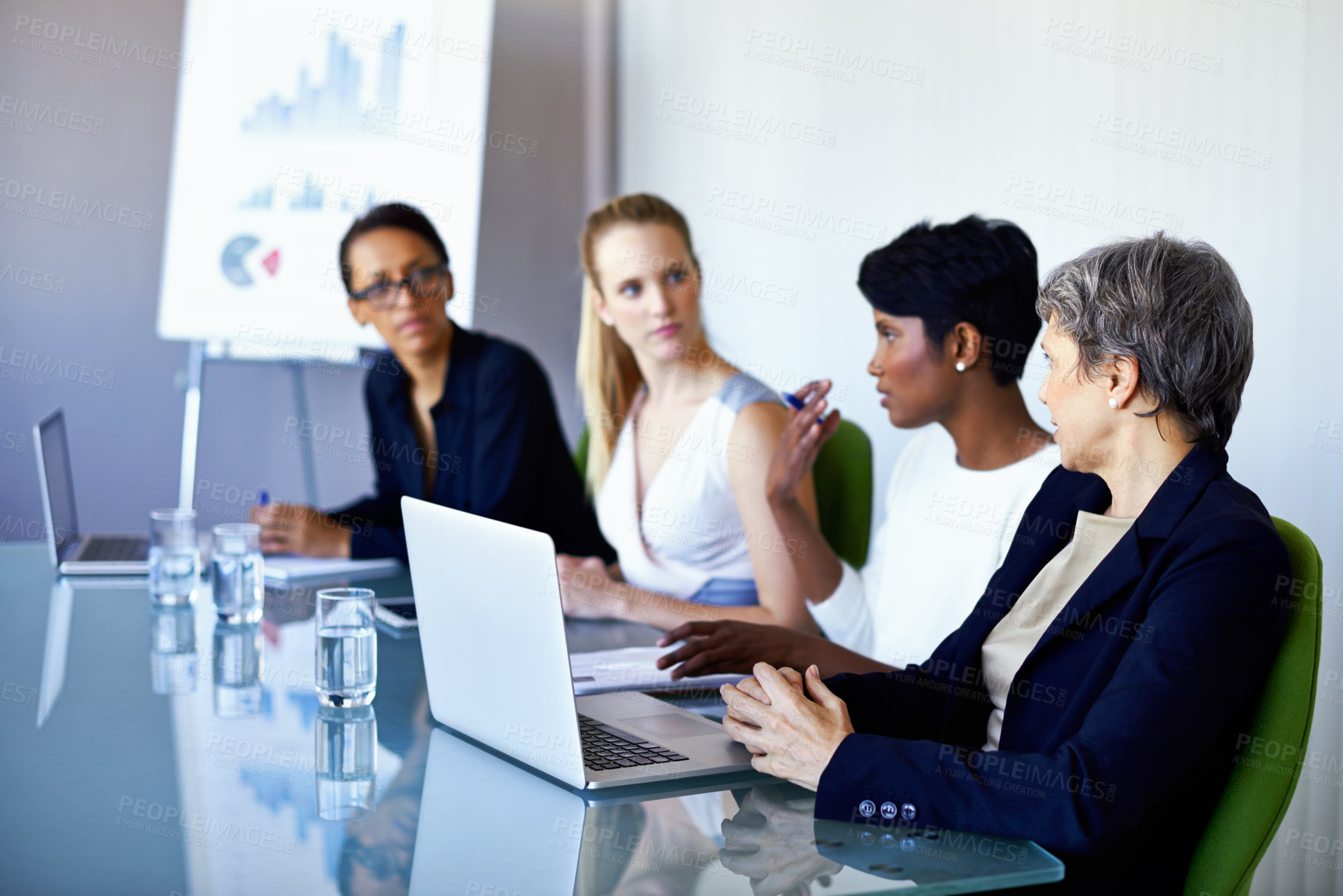 Buy stock photo Meeting, office and business people with laptop in discussion, talking and collaboration. Teamwork, corporate and women with chart, graph and research presentation for planning, review and growth