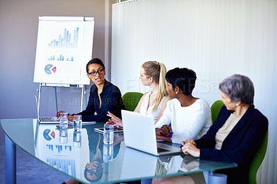 Buy stock photo Meeting, research and business women with statistics in discussion, talking and collaboration. Teamwork, corporate and people on laptop for chart, graph or presentation for planning, review or growth