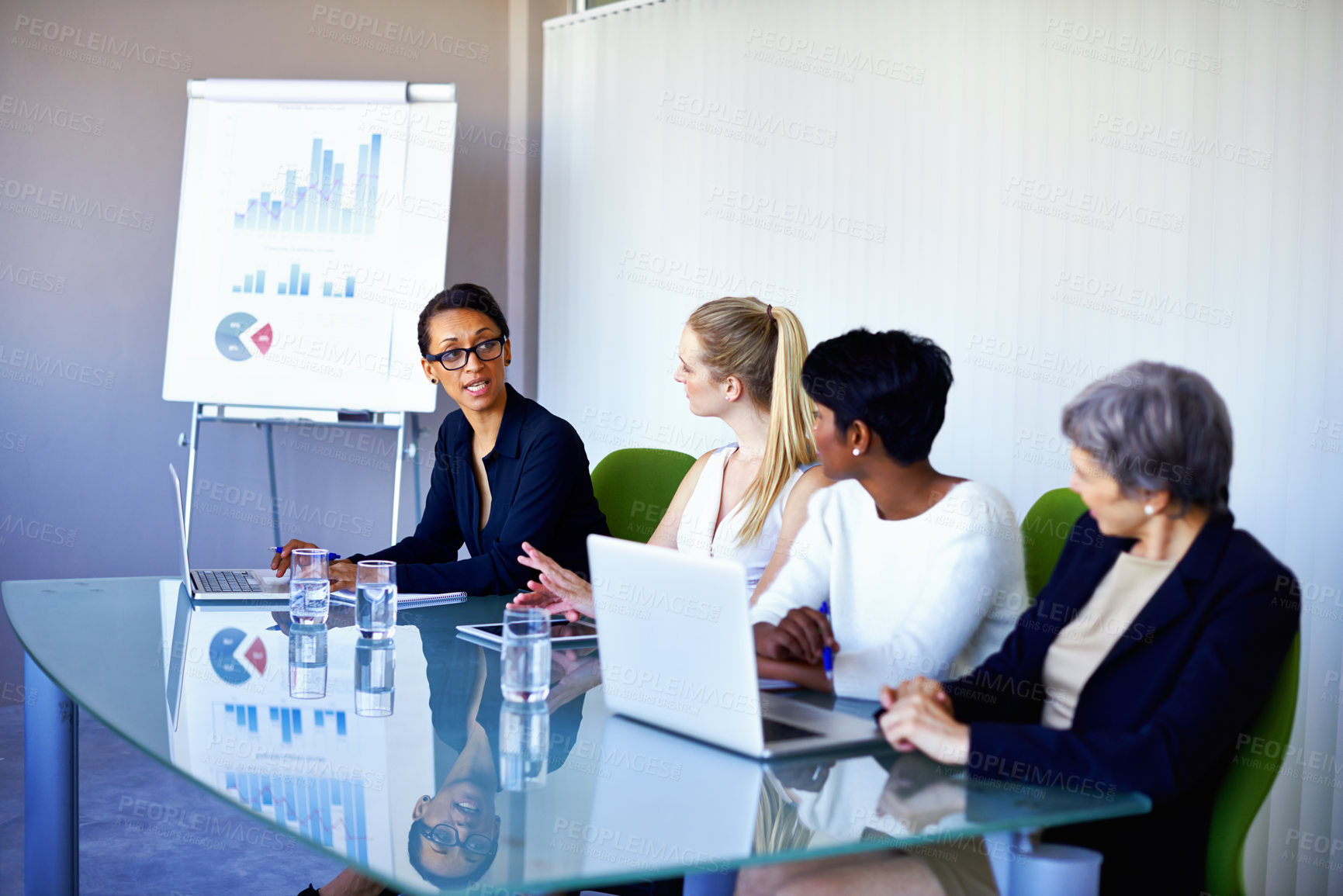 Buy stock photo Meeting, research and business women with statistics in discussion, talking and collaboration. Teamwork, corporate and people on laptop for chart, graph or presentation for planning, review or growth