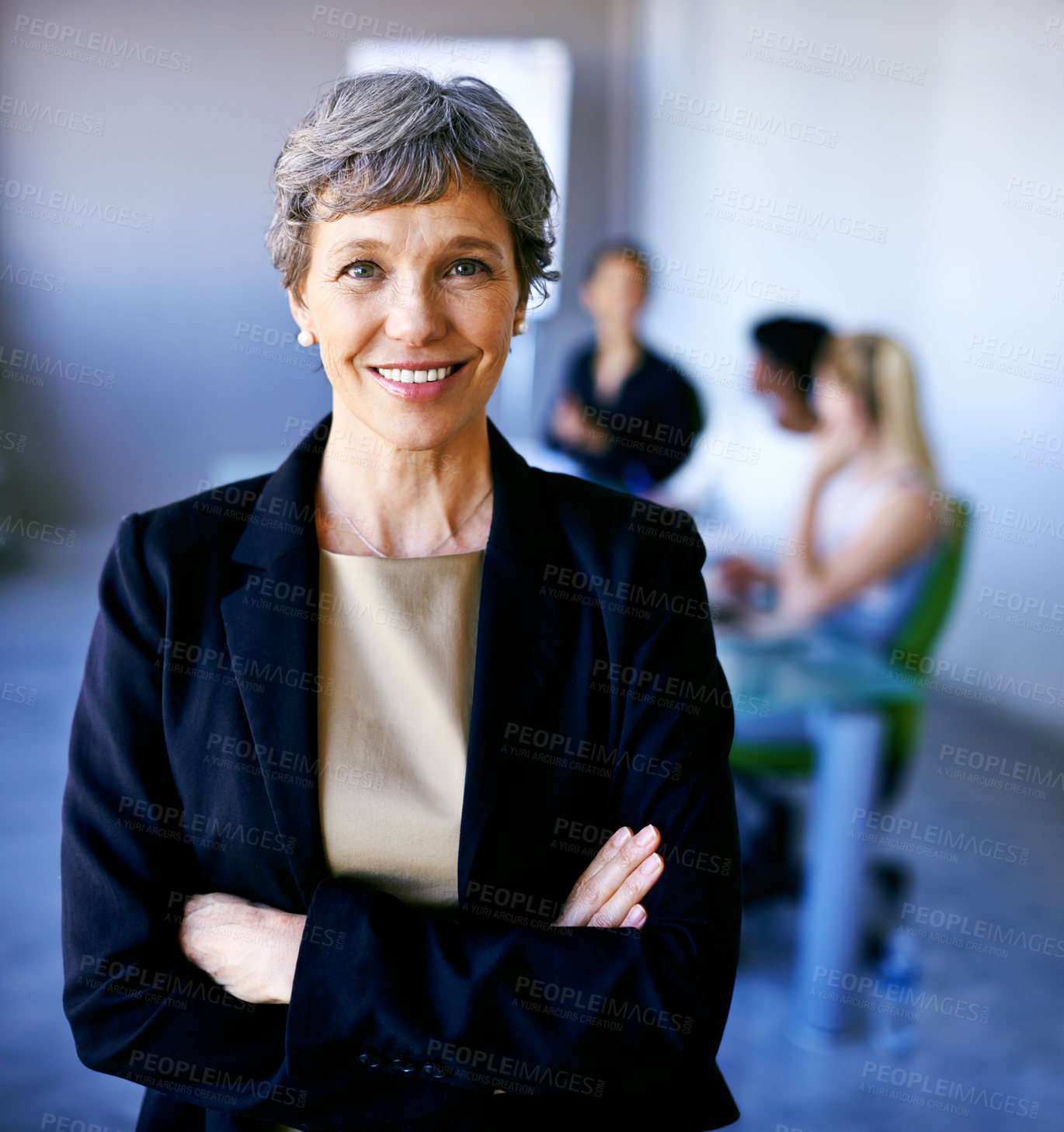Buy stock photo Portrait of a businesswoman standing in front of her colleagues during a meeting