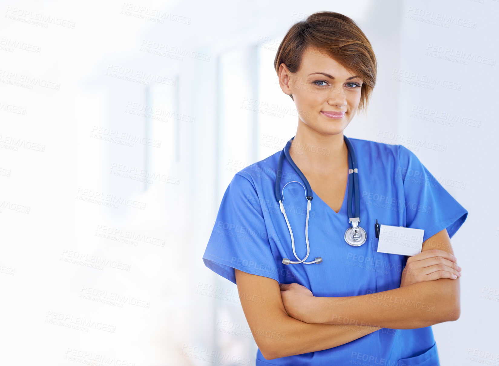 Buy stock photo Pride, arms crossed and portrait of nurse in healthcare for clinic, support and life insurance. Scrubs, stethoscope and woman with smile for confidence, medical service and wellness at hospital