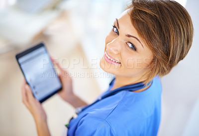 Buy stock photo Healthcare, tablet and portrait of nurse woman in scrubs at hospital for research or info from above. Medical, technology and smile on face of happy young medicine professional in clinic for results