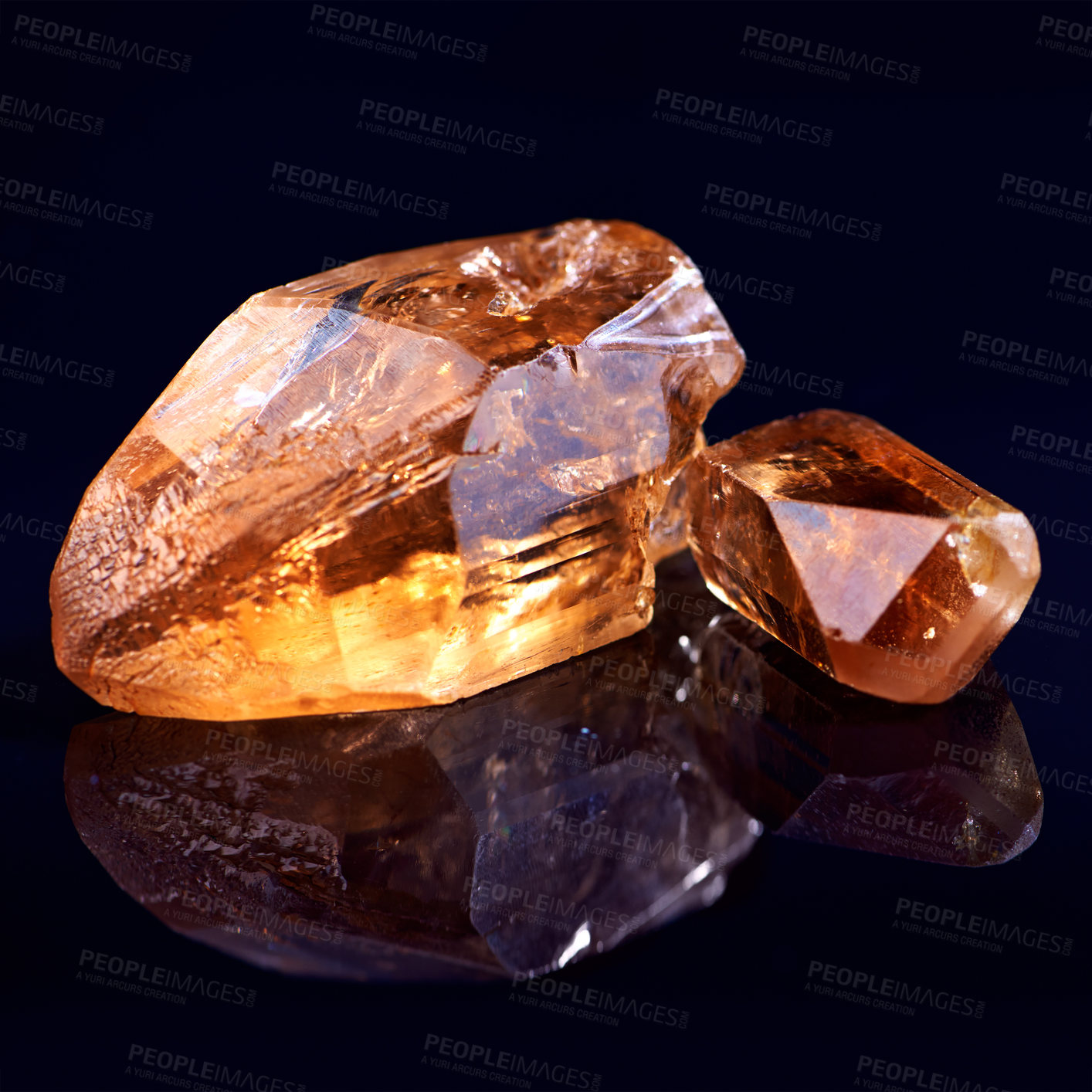 Buy stock photo Orange stone, jewel studio by black background for natural resource, garnet or sparkle for luxury. Rock, gemstone or crystal in closeup for shine, glow and uncut mineral with reflection for wealth