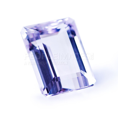 Buy stock photo Violet, gemstone or jewelry on a white background for luxury, expensive and rich design in studio. Purple, diamond or crystal rock for texture, glamor and ring with shine and reflection for gift