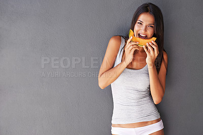 Buy stock photo Slice of melon, portrait and woman with nutrition, wellness and person on a grey background. Face, model and girl eating a fruit, delicious or mockup space with diet plan and healthy snack with smile