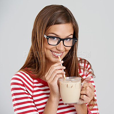 Buy stock photo Woman, portrait and milkshake drinking in studio or sweet beverage for weekend relax, dessert or grey background. Female person, glasses and straw for chocolate smoothie, mockup space or happiness