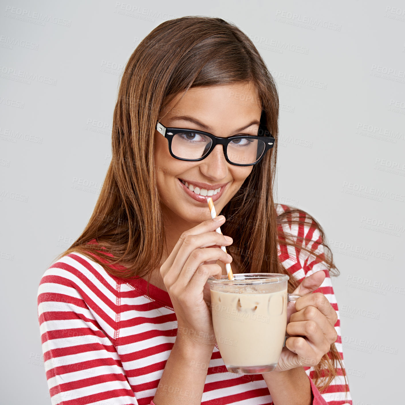Buy stock photo Woman, portrait and milkshake drinking in studio or sweet beverage for weekend relax, dessert or grey background. Female person, glasses and straw for chocolate smoothie, mockup space or happiness