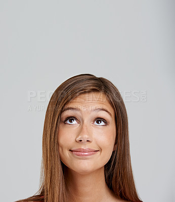 Buy stock photo Closeup shot of an attractive young woman looking up