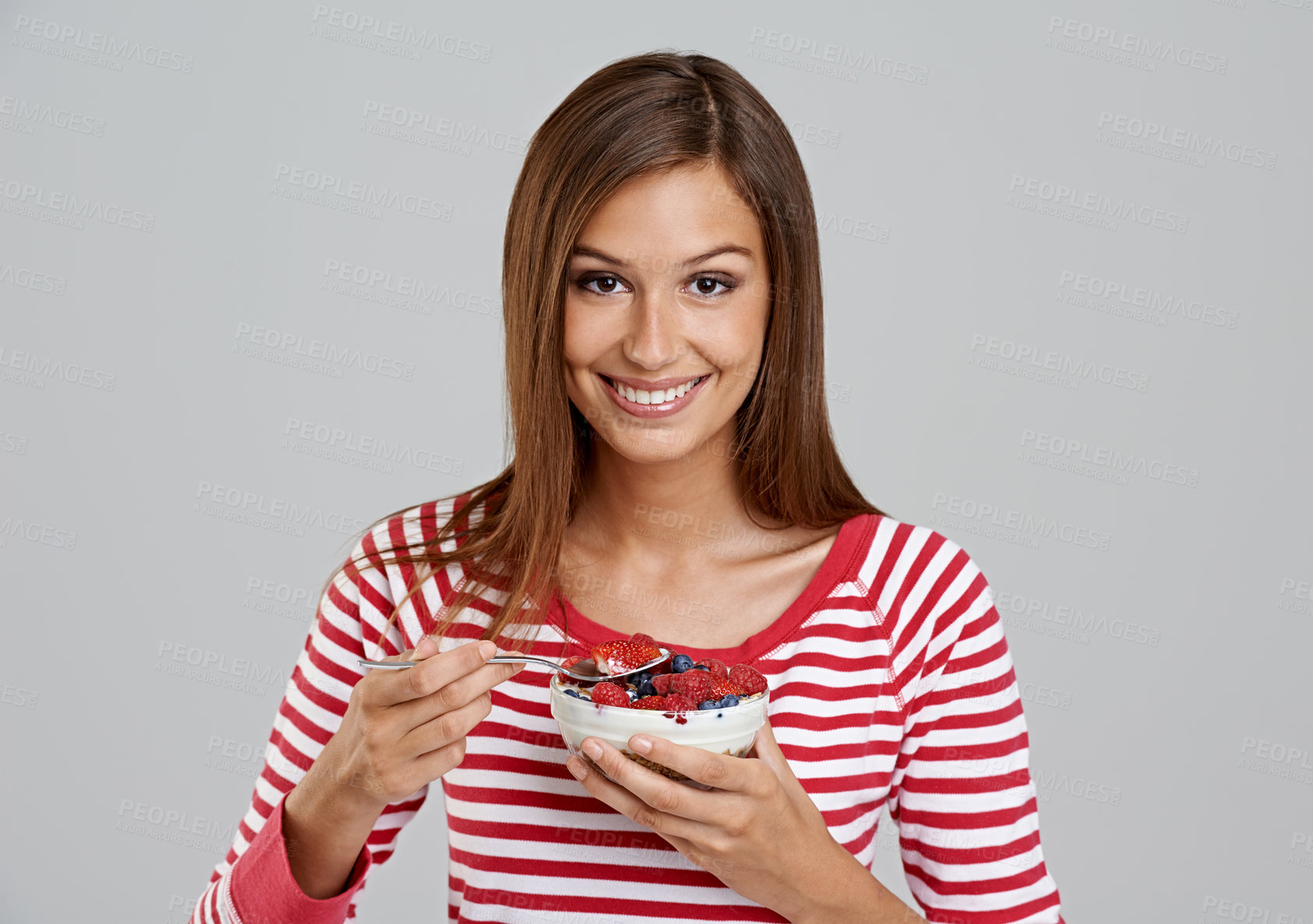 Buy stock photo Woman, bowl and smile with studio, berries and happiness for health and wellness. Person, diet and nutrition with fruit, snack and organic salad for hungry or eating isolated on white background