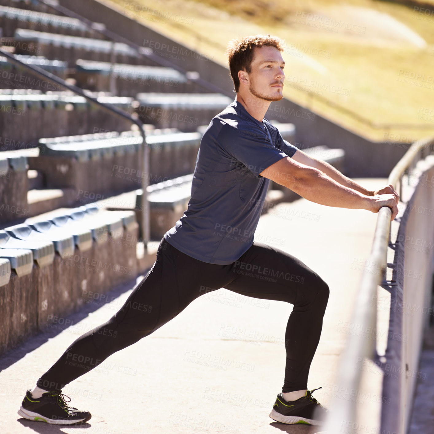 Buy stock photo Sports, legs and man stretching at stadium for race, marathon or competition training for health. Fitness, wellness and male runner athlete with warm up exercise for running cardio workout on track.