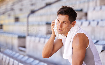 Buy stock photo Shot of an athlete taking a break from training