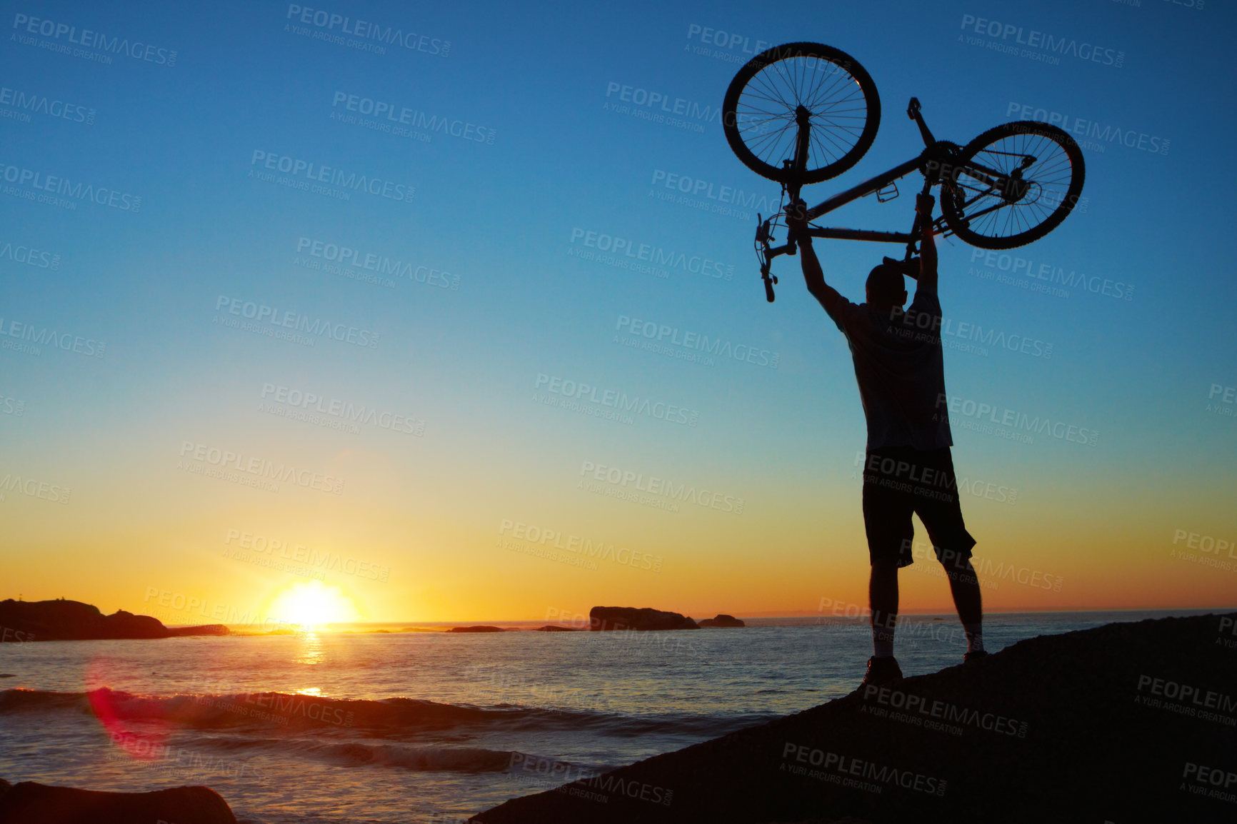 Buy stock photo Cropped shot of a handsome young cyclist outdoors