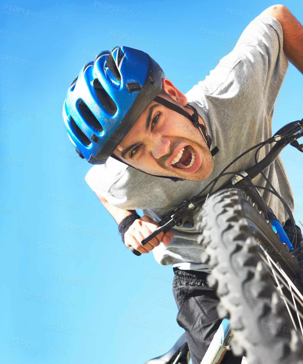 Buy stock photo Cropped shot of a handsome young cyclist outdoors