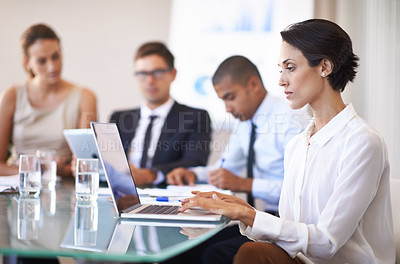 Buy stock photo Woman, boardroom and typing in laptop on meeting to brainstorm for contract, paperwork and teamwork. Business people, personal assistant and confident in table with strategy, feedback and company
