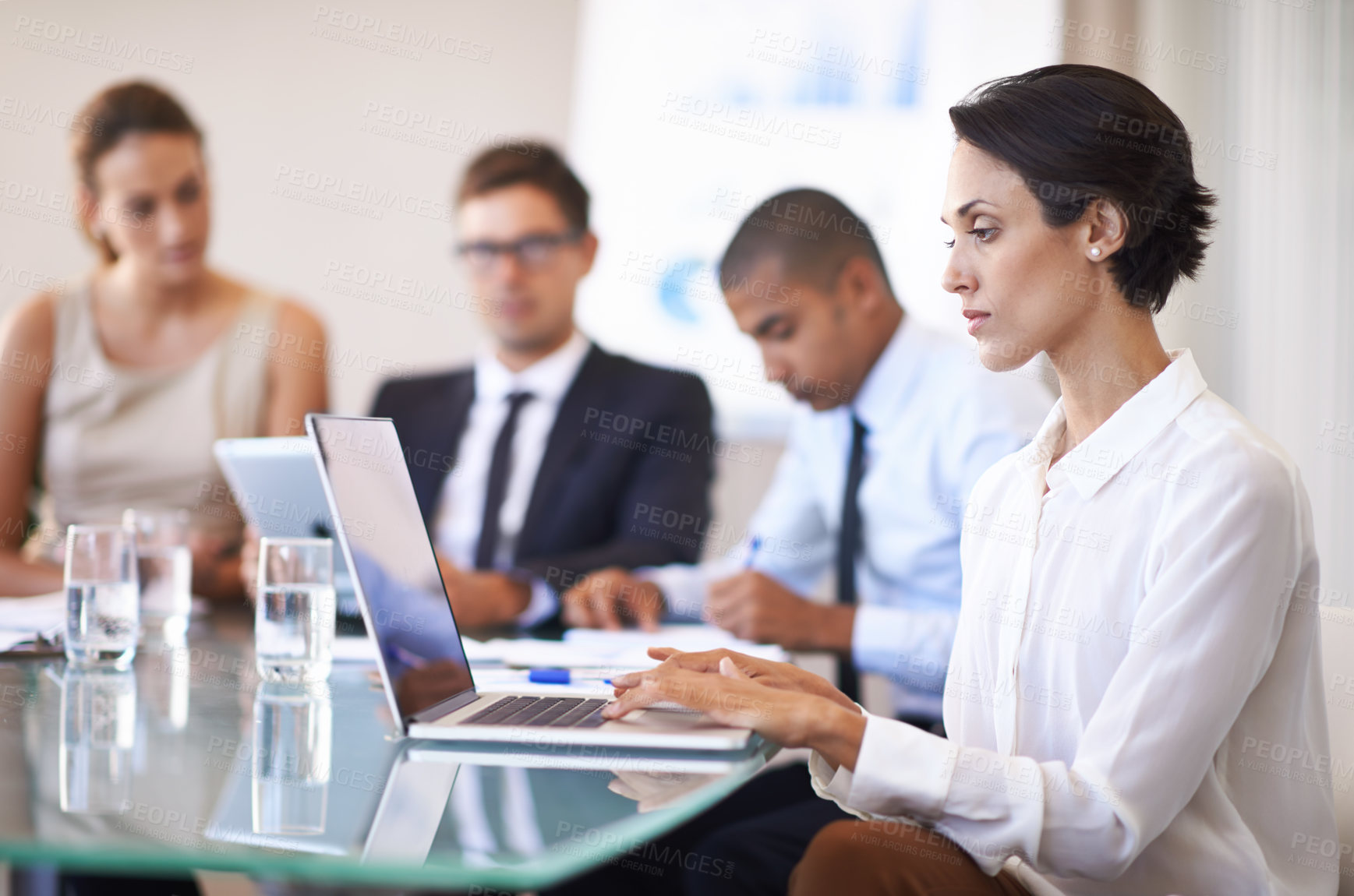 Buy stock photo Woman, boardroom and typing in laptop on meeting to brainstorm for contract, paperwork and teamwork. Business people, personal assistant and confident in table with strategy, feedback and company