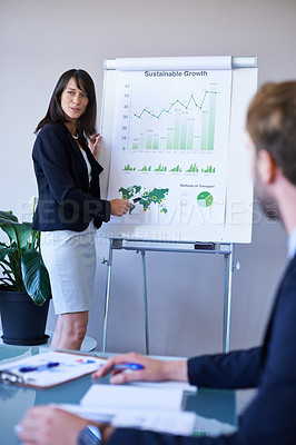 Buy stock photo Businesswoman, presentation and conference room with charts for analytics report or growth, development or graphs. Female person, colleagues and company strategy or finance sales, meeting or teamwork