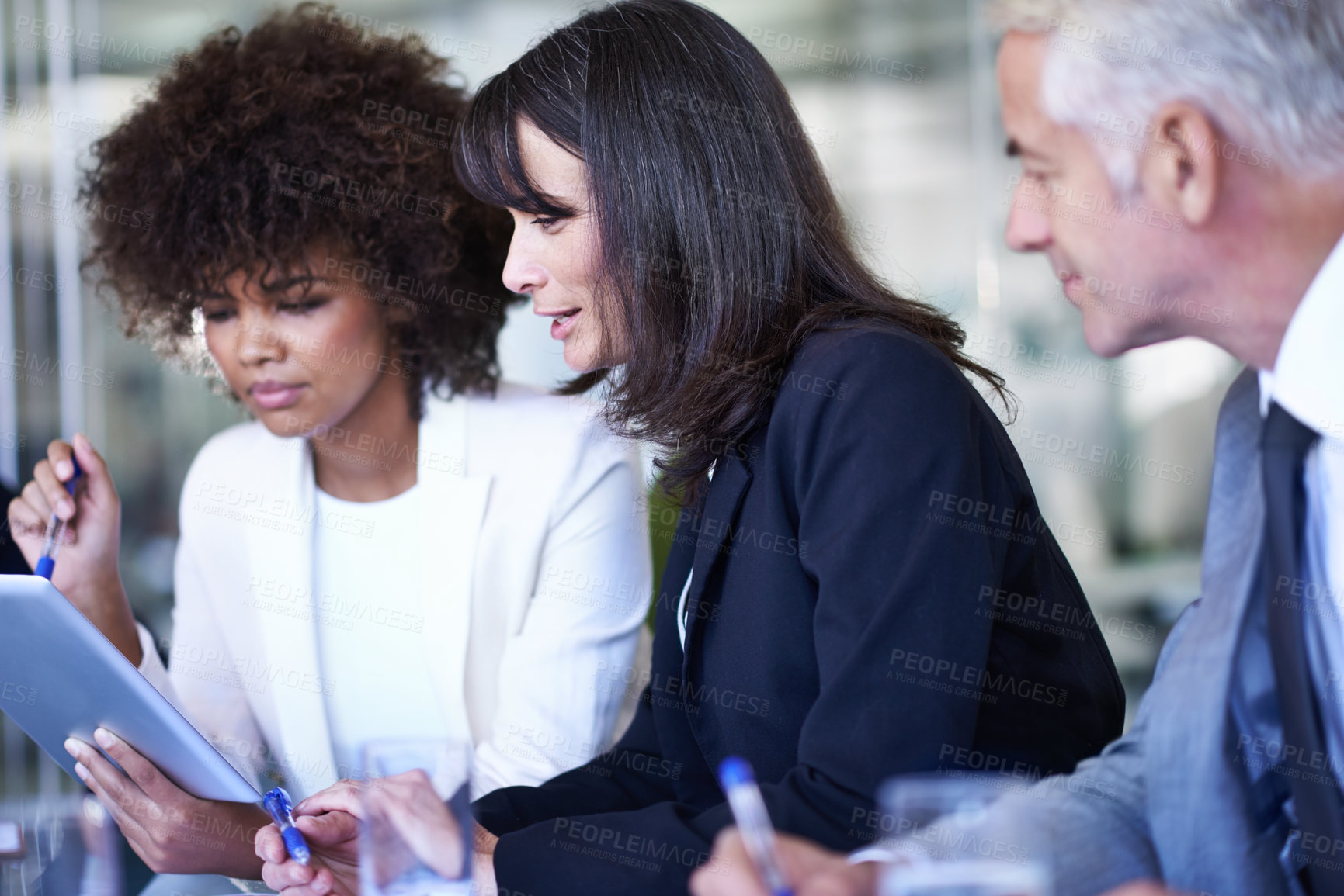 Buy stock photo Group, tablet and business people in discussion, planning and brainstorming digital in office. Collaboration, technology or diverse professional team, CEO and consultants in conversation at meeting