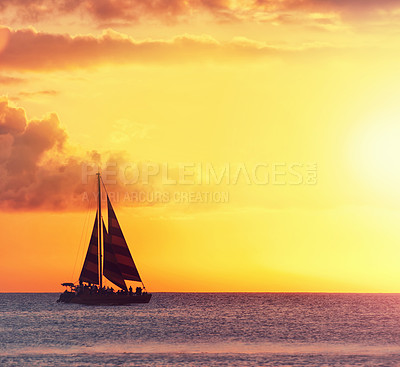 Buy stock photo Sunset, sailboat and water in ocean landscape, clouds and fog for scenery view. Evening, golden sky and sunshine in beach waves, destination and yacht or ship for transportation or travel in sea