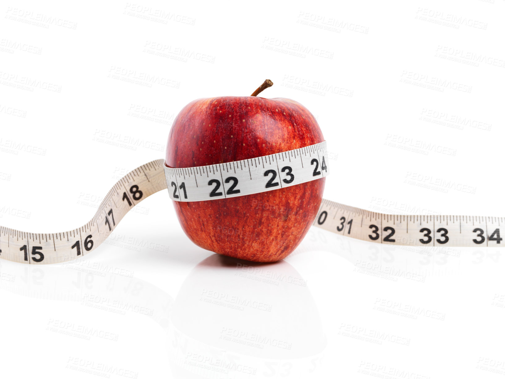 Buy stock photo Apple, wellness and tape measure with red fruit in studio isolated on white background for diet, health or nutrition. Sustainability, vitamins and size with organic produce for detox or weightloss