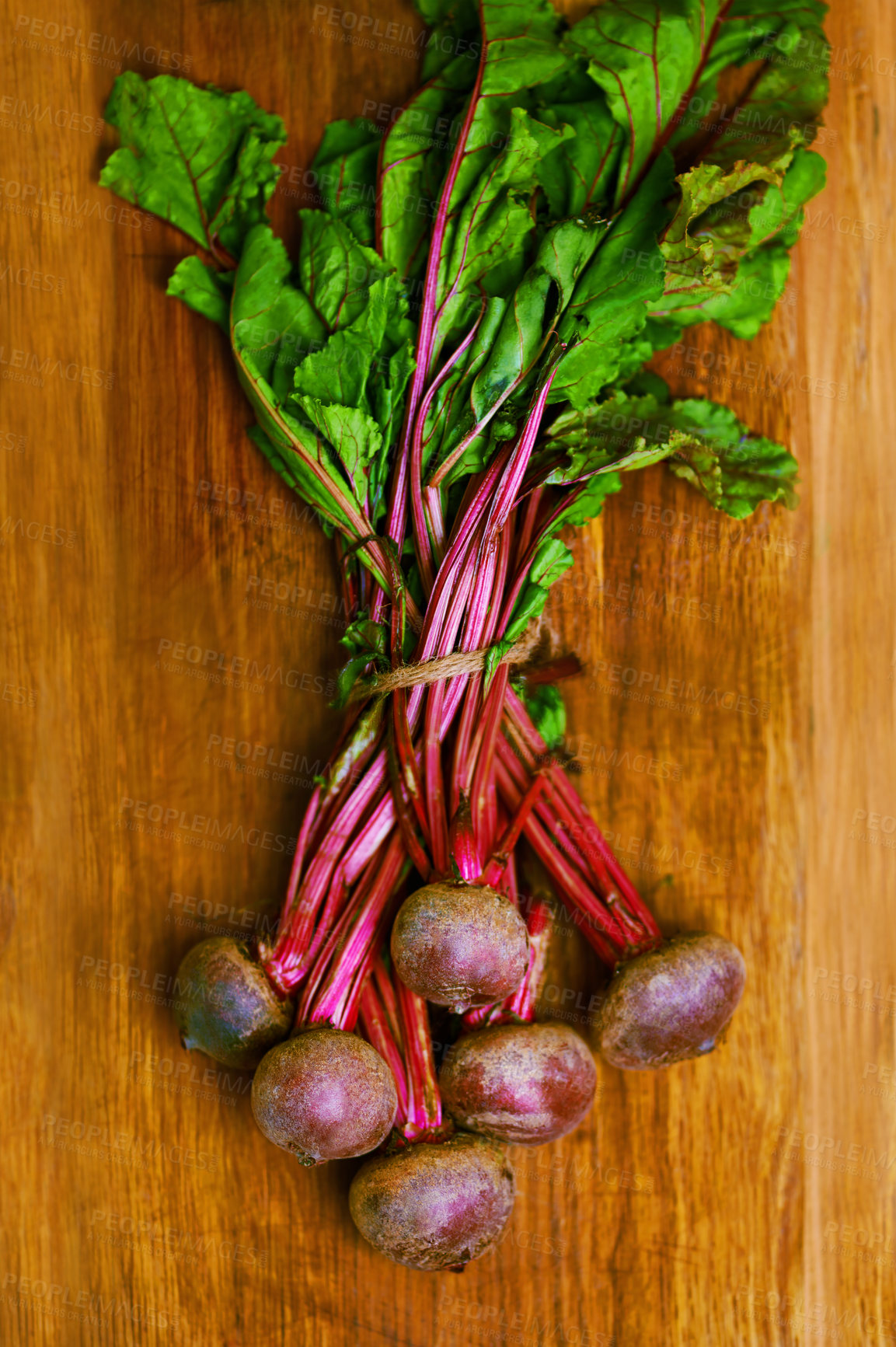 Buy stock photo Beetroot, closeup and counter for nutrition, wellness or organic diet on wood countertop. Vegetable, health or produce for eating, gourmet and meal or cuisine with vitamins or fibre for weight loss