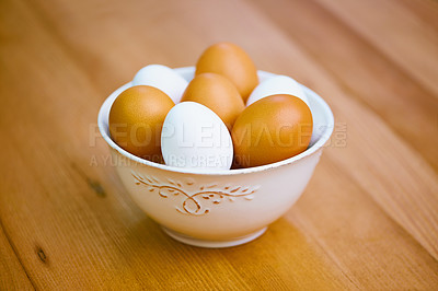 Buy stock photo Agriculture, food and eggs in bowl for sustainability, organic produce and reproduction with wellness. Diet, closeup and protein from livestock for nutrition, breakfast or healthy meal on table