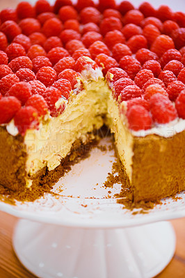 Buy stock photo Food, dessert and cheesecake for bakery, raspberries and sweet snack for eating. Fruit, cream and cake stand for display on table in pastry restaurant, creamy and luxury baked confection with berries