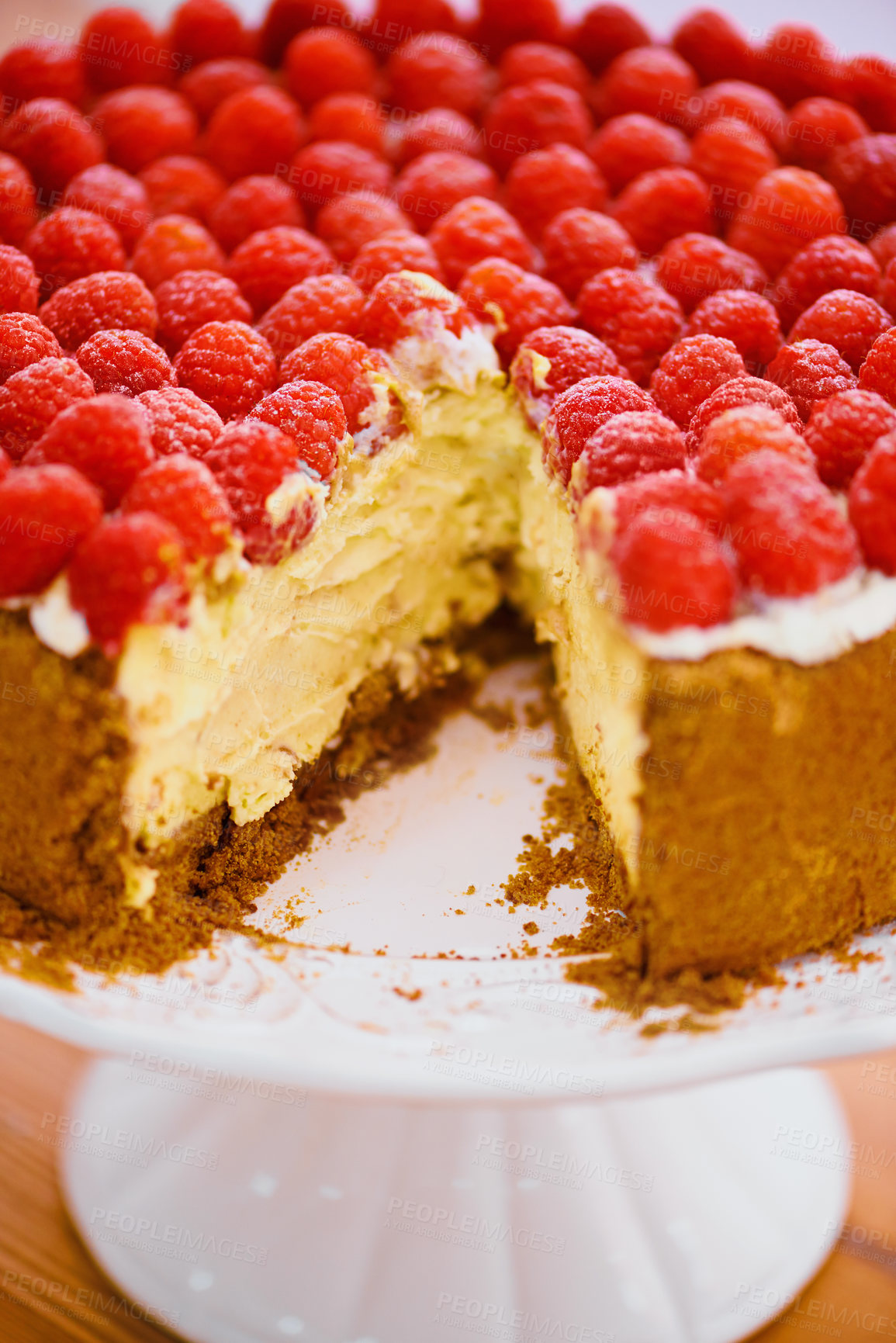 Buy stock photo Food, dessert and cheesecake for bakery, raspberries and sweet snack for eating. Fruit, cream and cake stand for display on table in pastry restaurant, creamy and luxury baked confection with berries