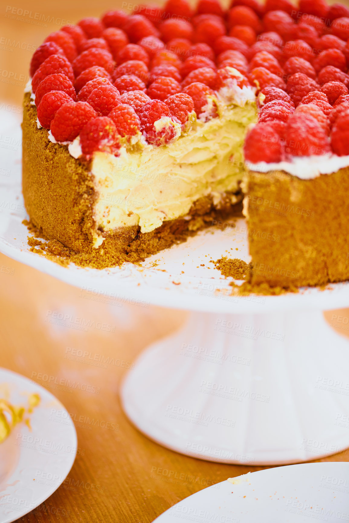 Buy stock photo Dessert, cheesecake and pastry for bakery, raspberries and sweet snack for eating. Fruit, slice and cake stand for display on table in food restaurant, creamy and luxury baked confection with berries