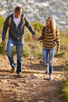 Buy stock photo Hiking, freedom and couple in nature, happy and bonding for holiday, vacation and trip to Amsterdam. Outdoor, man and woman together for love for anniversary of girl and male person holding hands