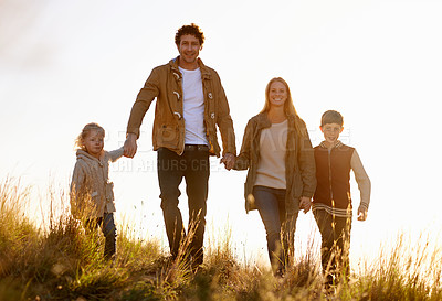 Buy stock photo Portrait of a happy family out on a morning walk together