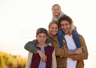 Buy stock photo Family, portrait and smile with field, walk and sunrise for morning exercise and bond. Parents, children and countryside for health, wellness and outdoor adventure at sunset for holiday or vacation.