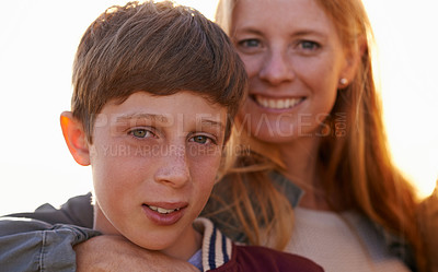 Buy stock photo Portrait, son and mother person with summer sunset, family and smile for happy parent. Child, boy or teenager with affection or hug from loving mom people, bonding and love with lens flare in nature