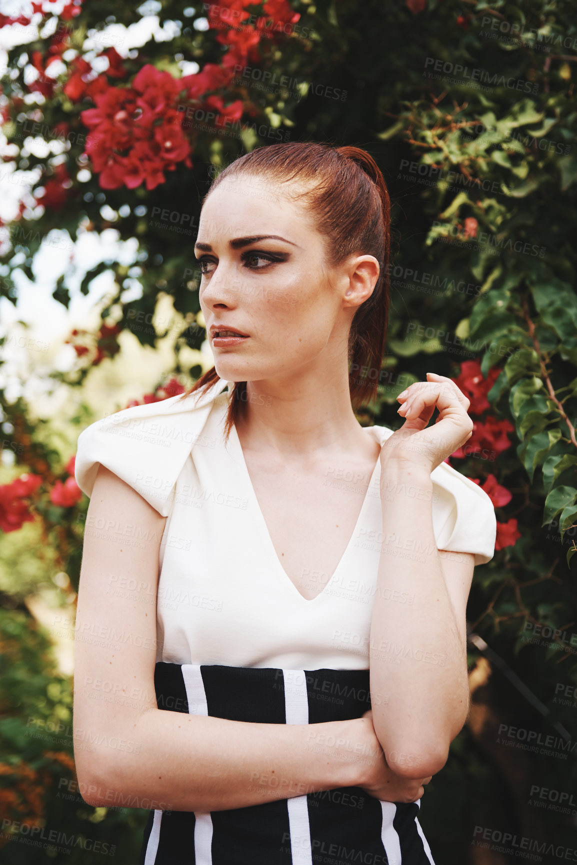 Buy stock photo Style, nature and young woman with beauty, elegant and trendy dress outfit with confidence. Attractive, makeup and female person with classy and edgy fashion by flowers, plants or bush in garden.